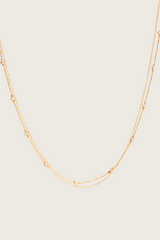 Collier en perles blanches avec incrustation en or 14 carats